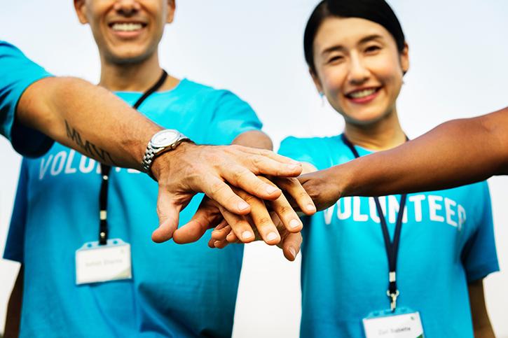 Volunteers joining hands