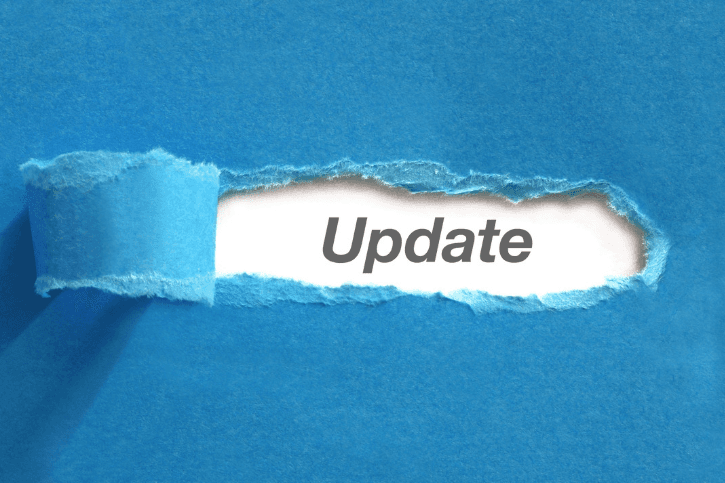 Blue paper torn back in the middle to reveal the word "Update."