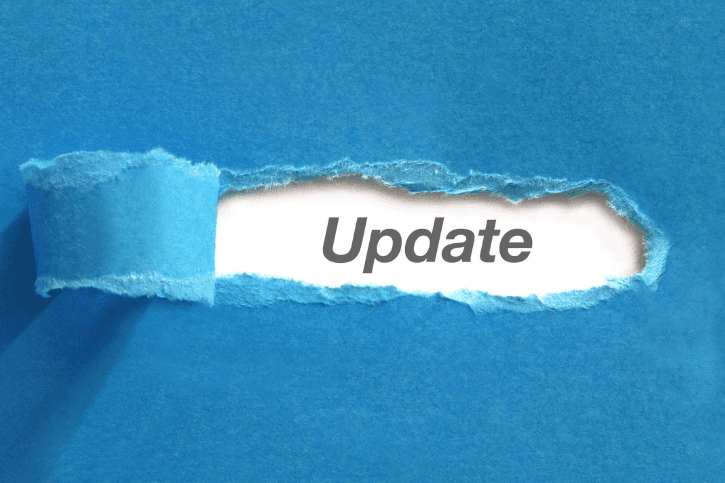 Blue paper torn back in the middle to reveal the word "Update."