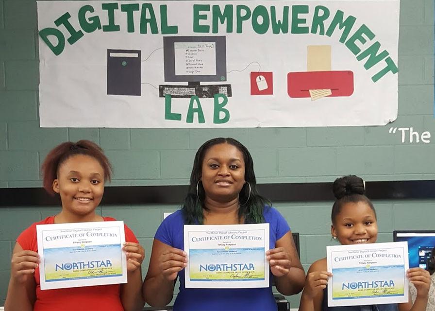 3 people hold certificates earned from the Digital Empowerment Lab
